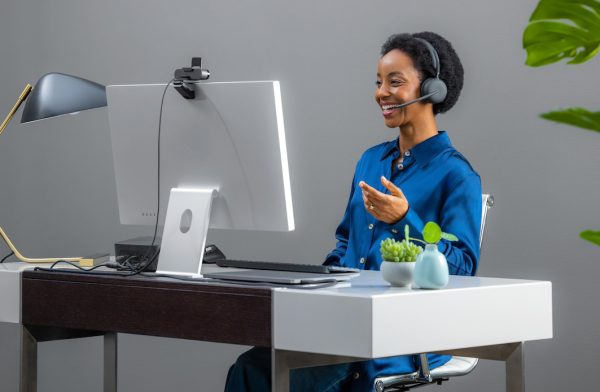 Woman wearing Logitech Zone Wireless 2